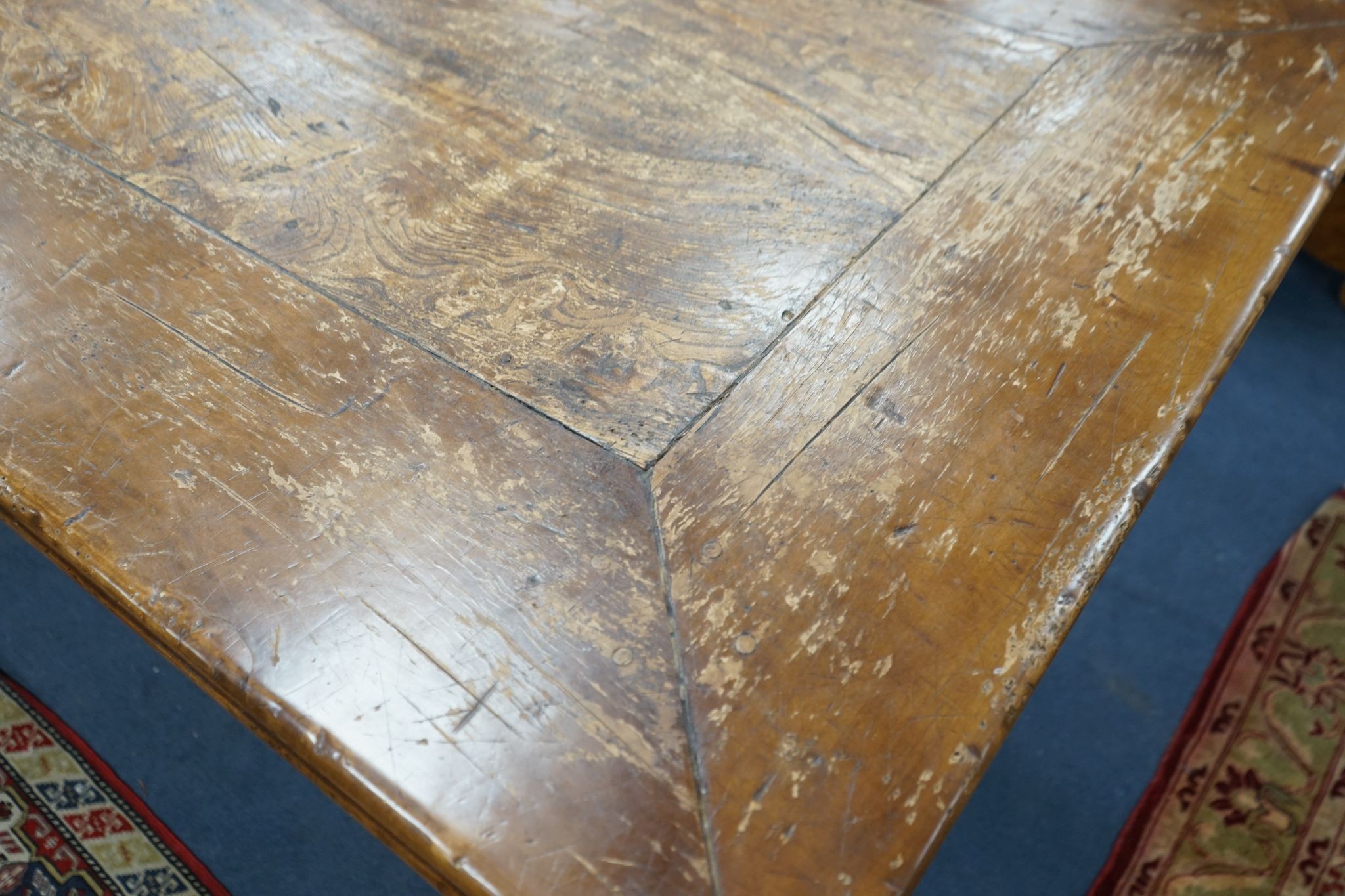 An 18th century style rectangular walnut refectory dining table on baluster end supports with central stretcher, length 270cm, width 106cm, height 76cm